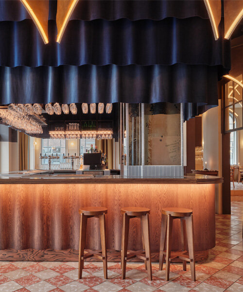 studio modijefsky revives dilapidated cinema as all-day brasserie in the netherlands