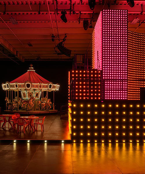 carsten höller transforms LA warehouse into prada double club carnival wonderland