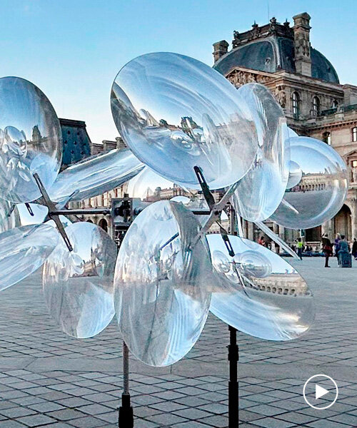 kinetic cloud's floating lenses by vincent leroy deform louvre's facade